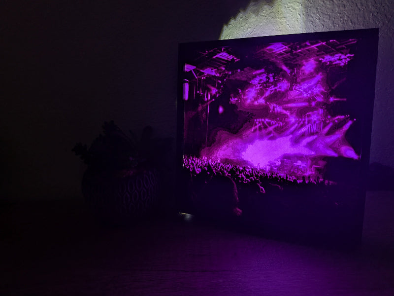 3D-printed illuminated art piece showcasing a vibrant Phish concert scene in purple lighting.