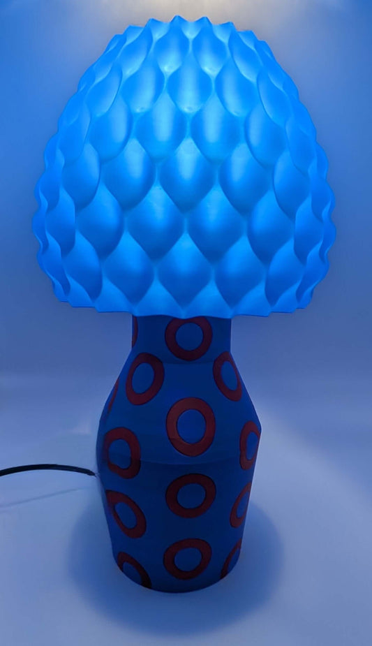 Blue Phishy Donut Lamp with geometric design and warm glow