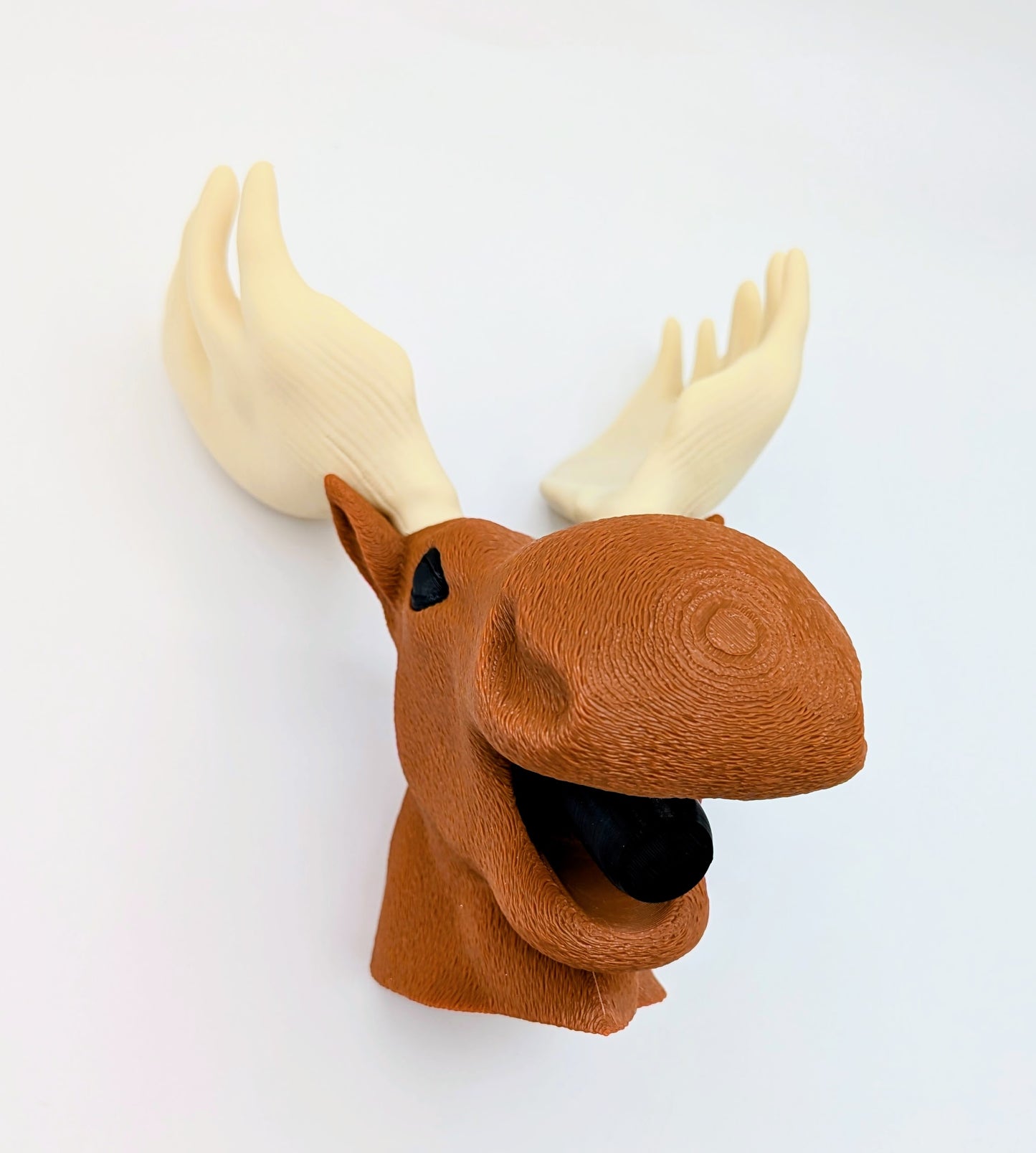 Moose wine stopper with a playful design featuring a moose head and antlers, perfect for wine lovers.