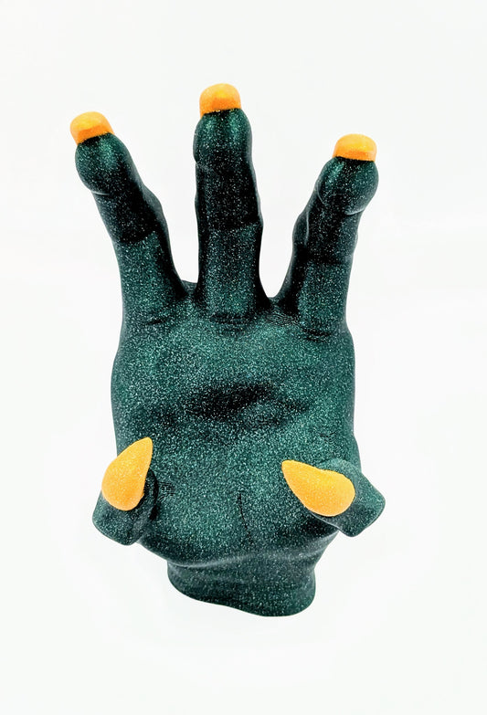 Monster Controller Stand featuring a glittery green hand design with orange tips for a unique gaming accessory.