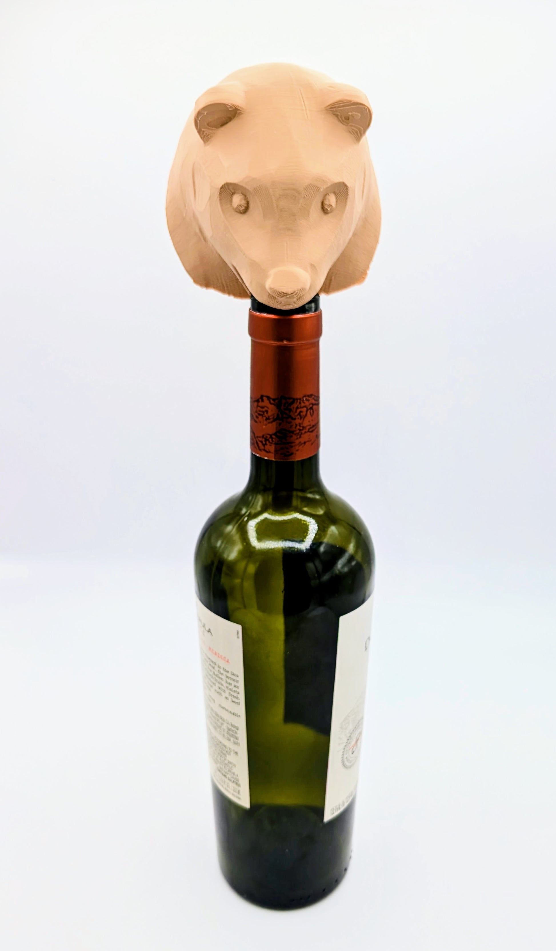 Bear wine stopper atop a green wine bottle, adding a playful touch to your wine storage. Perfect for animal lovers.