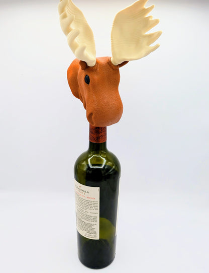 Moose wine stopper perched on a wine bottle, adding a fun and whimsical touch to your beverage storage.