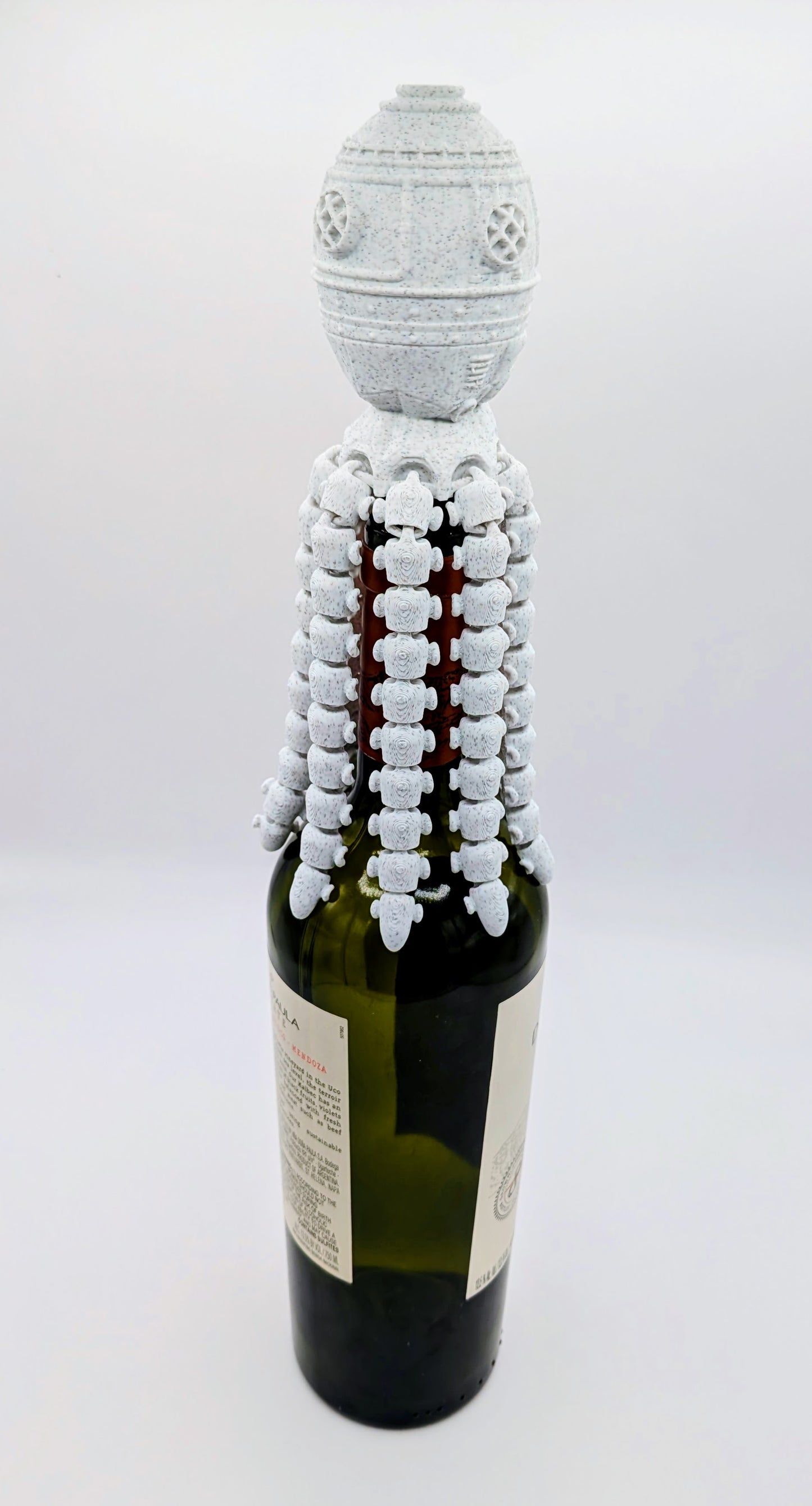 OctoGauge Wine Stopper designed like an octopus, elegantly securing a wine bottle with a unique tentacle design.