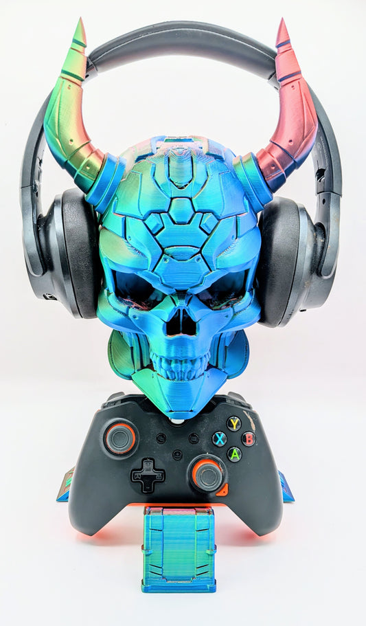 Demon skull display featuring colorful headphones and a game controller, perfect for gamers and collectors.