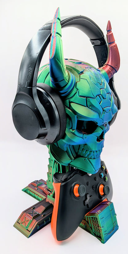 Colorful demon skull display with headphones and game controller, perfect for gamers and headphone enthusiasts.