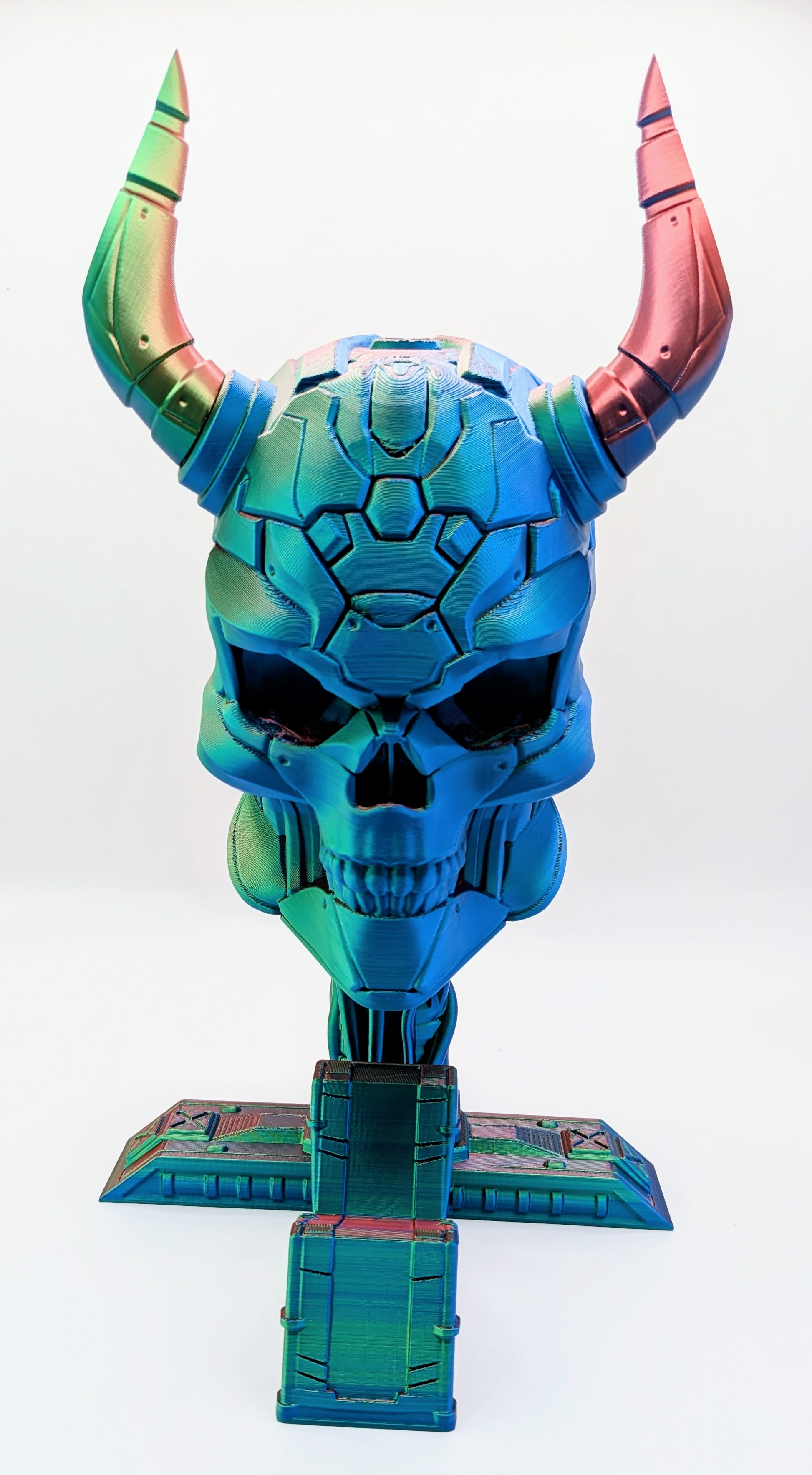 Demon skull headphone and game controller display stand, featuring vibrant colors and intricate design elements.